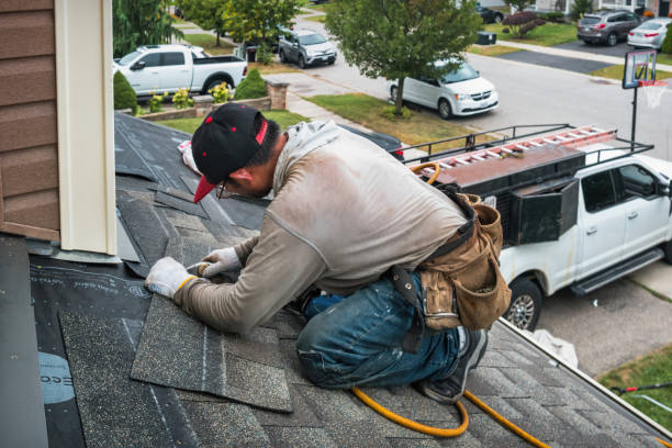 Professional Storm Damage Roof Repair technician working in Jupiter, FL